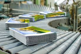 Freshly printed books on a press